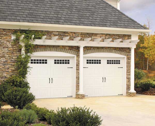 Garage door with decorative handles