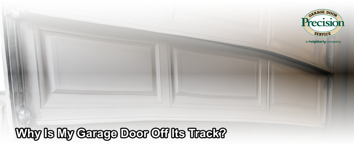 A residential garage door that has come off its track, showing a bent rail and misaligned panel in a Chicago home garage