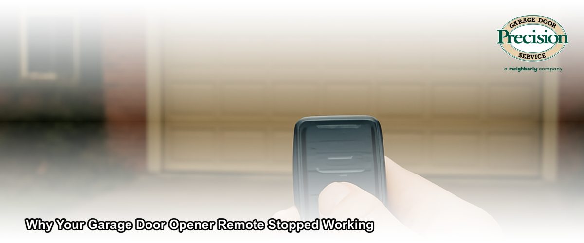 A person pressing a garage door opener remote in front of a closed residential garage door in Chicago, Illinois