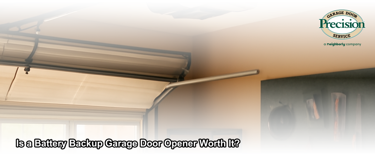 A modern garage door opener with battery backup unit mounted on the ceiling of a Chicago home garage