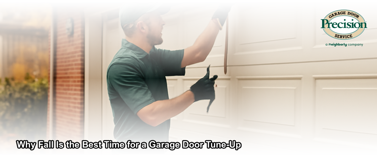 A garage door technician performing a fall tune-up on a residential garage door in a Chicago neighborhood with autumn leaves on the ground