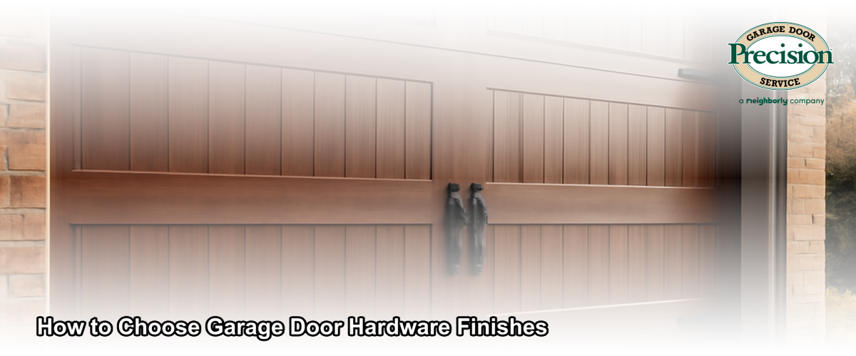 Close-up of decorative garage door hardware finishes including matte black hinges and handles on a carriage-style garage door